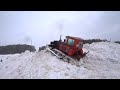 ДТ75 и КИРОВЕЦ выгребают горы снега.