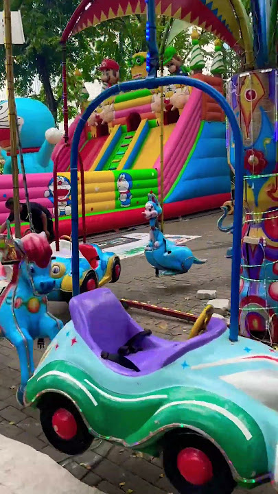 Buy ice cream at the mini market and play the merry-go-round with Kak Fuji