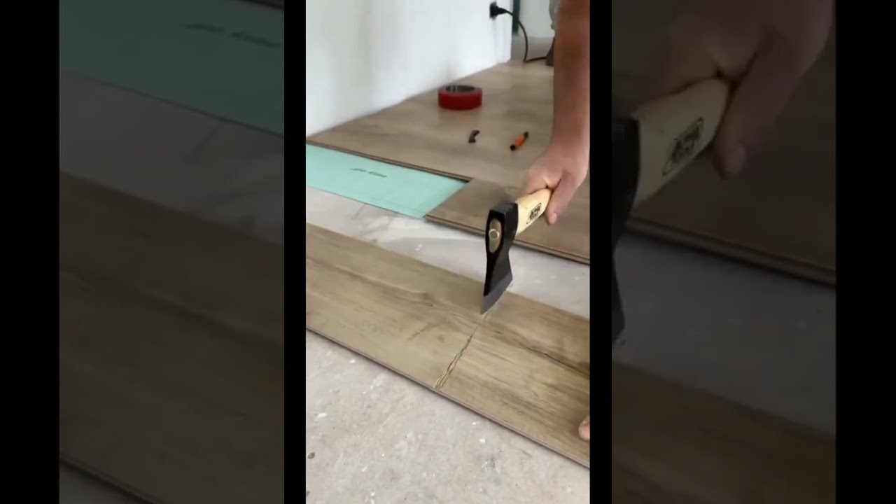 Vinyl verlegen / Vinyl schneiden / Schaden an Laminat / Laminat verlegen / Axt