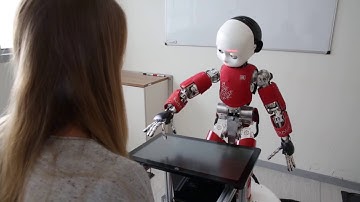 Interacting with a Social Robot Affects Visual Perception of Space