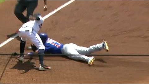 Kris Bryant leaves game after sliding into third