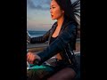 Beauty riding a peacock-inspired motorcycle,