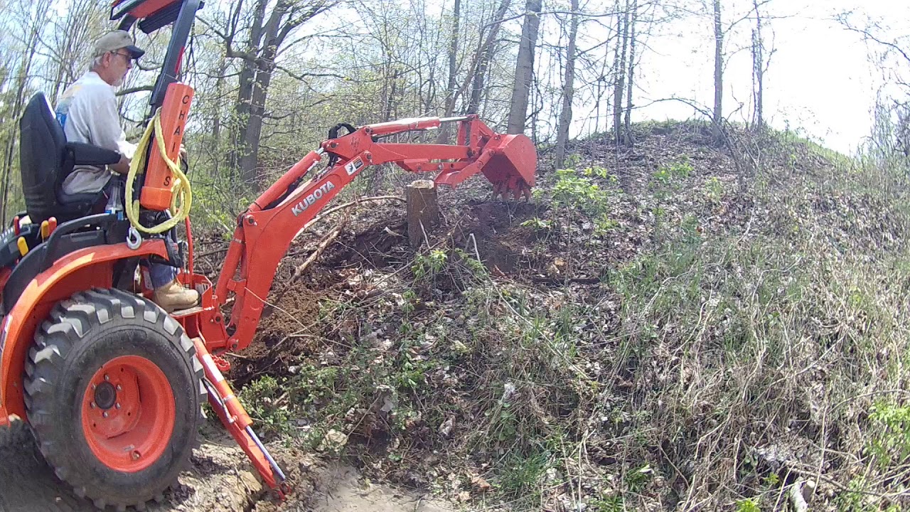 2017 Kubota B2601 Digging up stump for the widening of the drive.