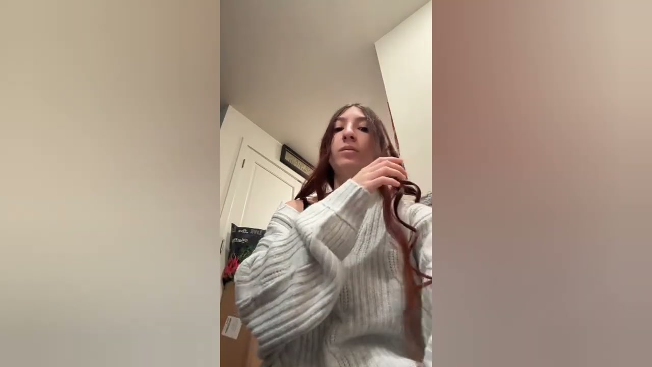 Miss is curling her hair