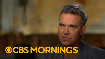 Robbie Williams discusses unique portrayal in "Better Man" and living a life "based on audacity"