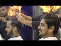 Indian barber cuts mens hair by setting it on fire