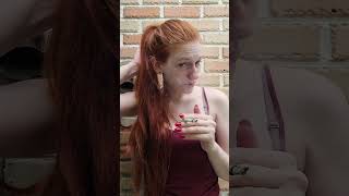 Smoking red-haired girl
