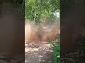 Textron 500 ATV makes big muddy water splash