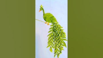 Beautiful peacock making with leaves🦚 🍃#peacock #leafart #shortvideo #youtubeshorts #art #viralvideo