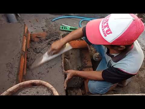 Video: Bagaimana Anda menutupi tangga bata dengan batu?