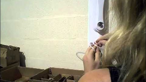 Raising a flag using an internal halyard system flagpole