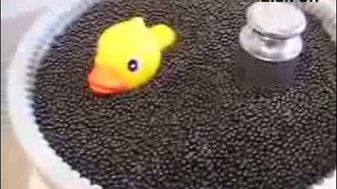 sinking and floating in a sheared granular liquid