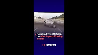 Police pull tyre off stolen car after it sped off during a chase