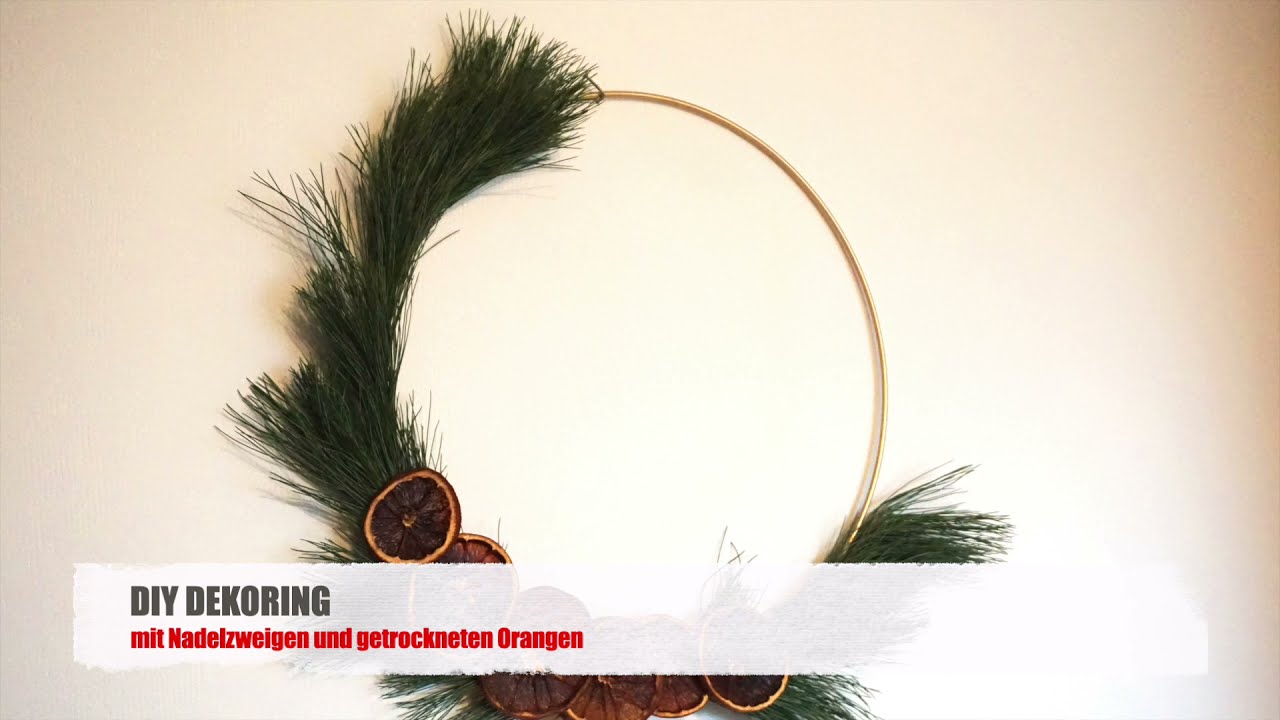 DIY Dekoring mit Zweigen und getrockneten Orangen