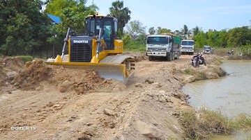 The Heavy equipment Dozer Shantui DH17c3 working​ Push the soil into the water Dump Truck​ HYUINDAI