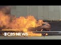Burning car rescue caught on camera