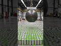 Dropping a Giant Magnetic Ball into Five Thousand Metal Cans Filled with Goo