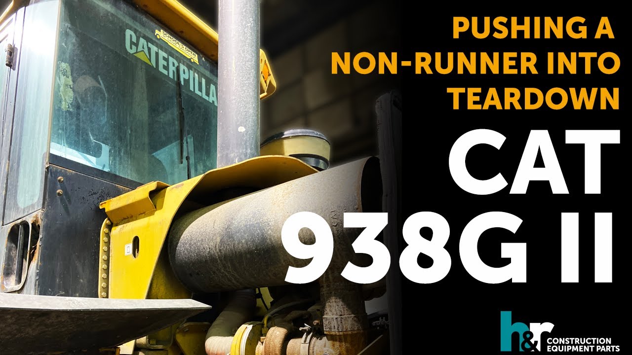 CAT 938G II Wheel Loader. Pushing A Non-Runner Into Teardown.