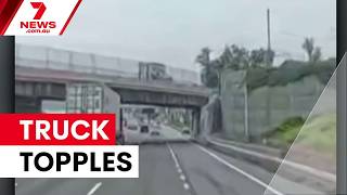 Truck topples after slamming into New York overpass 7NEWS