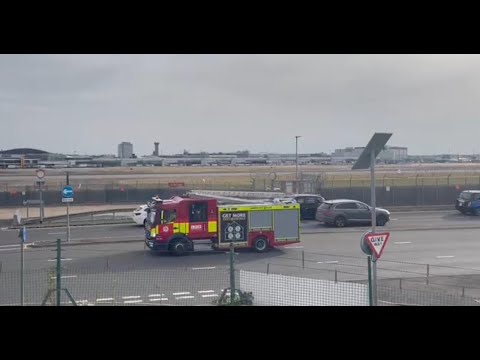 Aer Lingus #EI168 just met by fire trucks and police at London Heathrow