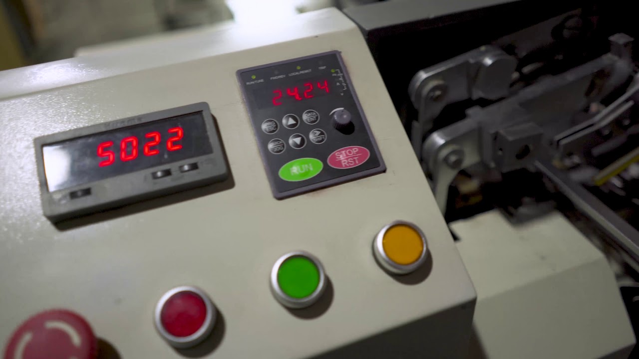 Automatic price tag threading machine - YouTube