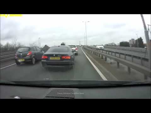 Moment undertaking BMW swerves between cars, almost causing high-speed smash