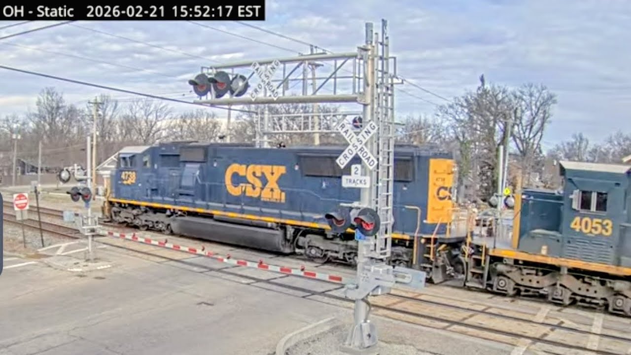Northbound CSX M560 mixed manifest on track two with modern EMD leader and two vintage EMD 