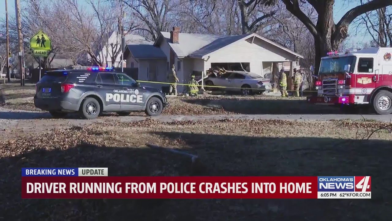 Driver running from police crashes into home - YouTube