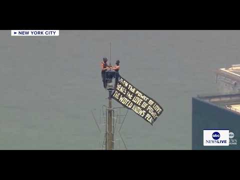 Two people climb Empire State Building
