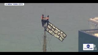 Two people climb Empire State Building