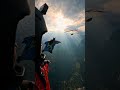Hang Glider Silhouette During a Wingsuit Flight