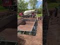 Pouring concrete for the pool base