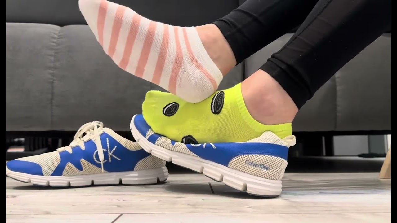 Calvin Klein running shoes with mismatched socks outfit