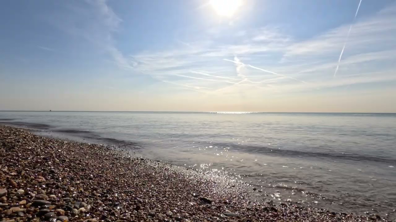 Serene Pebble Beach Under Bright Summer Sun
