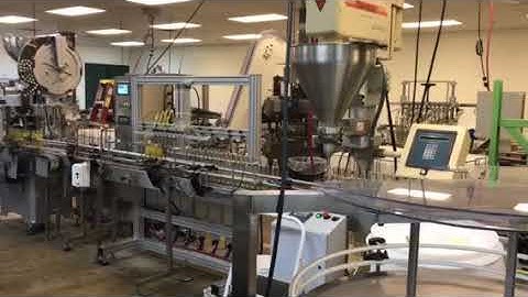 HyTek Automation Solutions - 8 Head Liquid Filler filling two different products simultaneously on