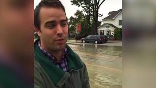 Downpour overwhelms city's sewers, causes flooding