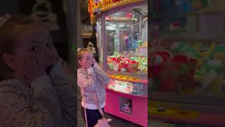 Precious Girl Gets a Stuffed Toy From the Claw Machine