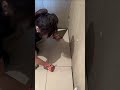 The process of installing granite ceramic tiles on the floor in the bathroom of a house #popular