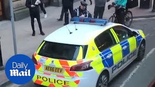 Moment determined traffic warden gives a police car a ticket