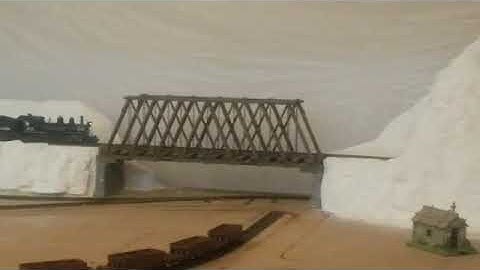 Portable HOn3 model railroad under construction with trains running