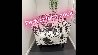 Style up a nook with this soft cow print chair
