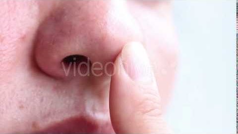 Woman Touching Her Nose