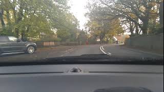 Pulling up on the left safely heading down St John's Road towards Buxton.