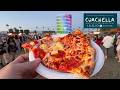 Dead tired Japanese Salaryman Eats expensive Pizza at Coachella