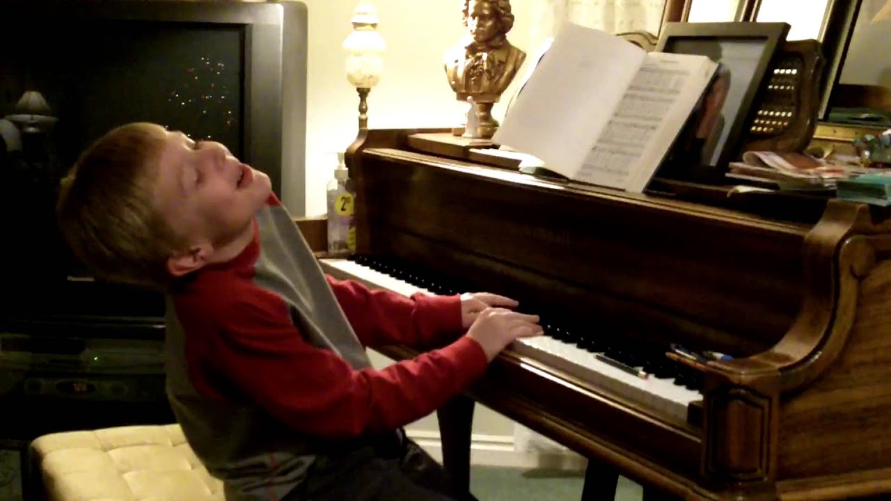 He can the piano. Аутизм и фортепиано. A boy Plays the Piano. Boy playing the Piano.