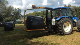 2018 Ag Wrap Bale Wrapper wrapping dry hay with skid steer and tractor