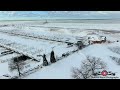 Flying over washington park  lighthouse after 35 inches of snow 4k drone footage