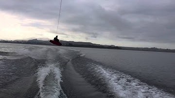 Wakeboarding tail grab 180