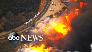 More than 140,000 acres have been burned by wind-fueled flames with
winds expected to pick up again through the weekend.