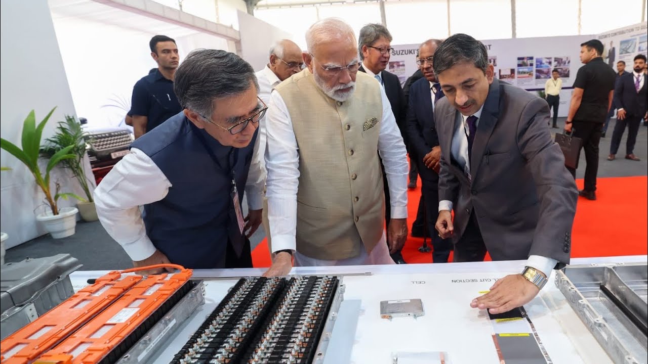 ev.Car and battery plant inauguration at Suzuki plant and overview of state development - short film